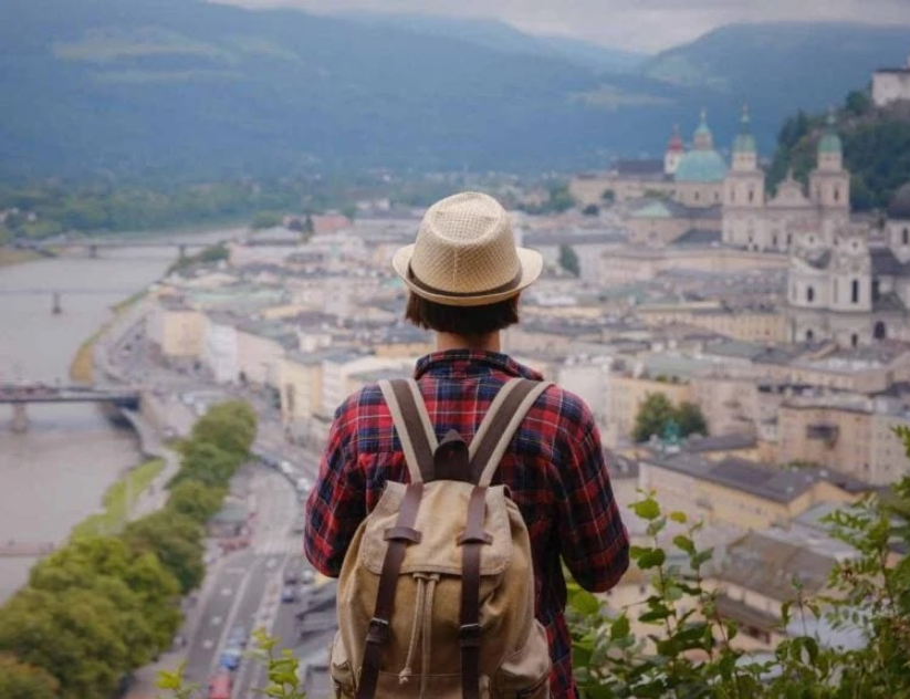 Solo female traveler overlooking a cultural town