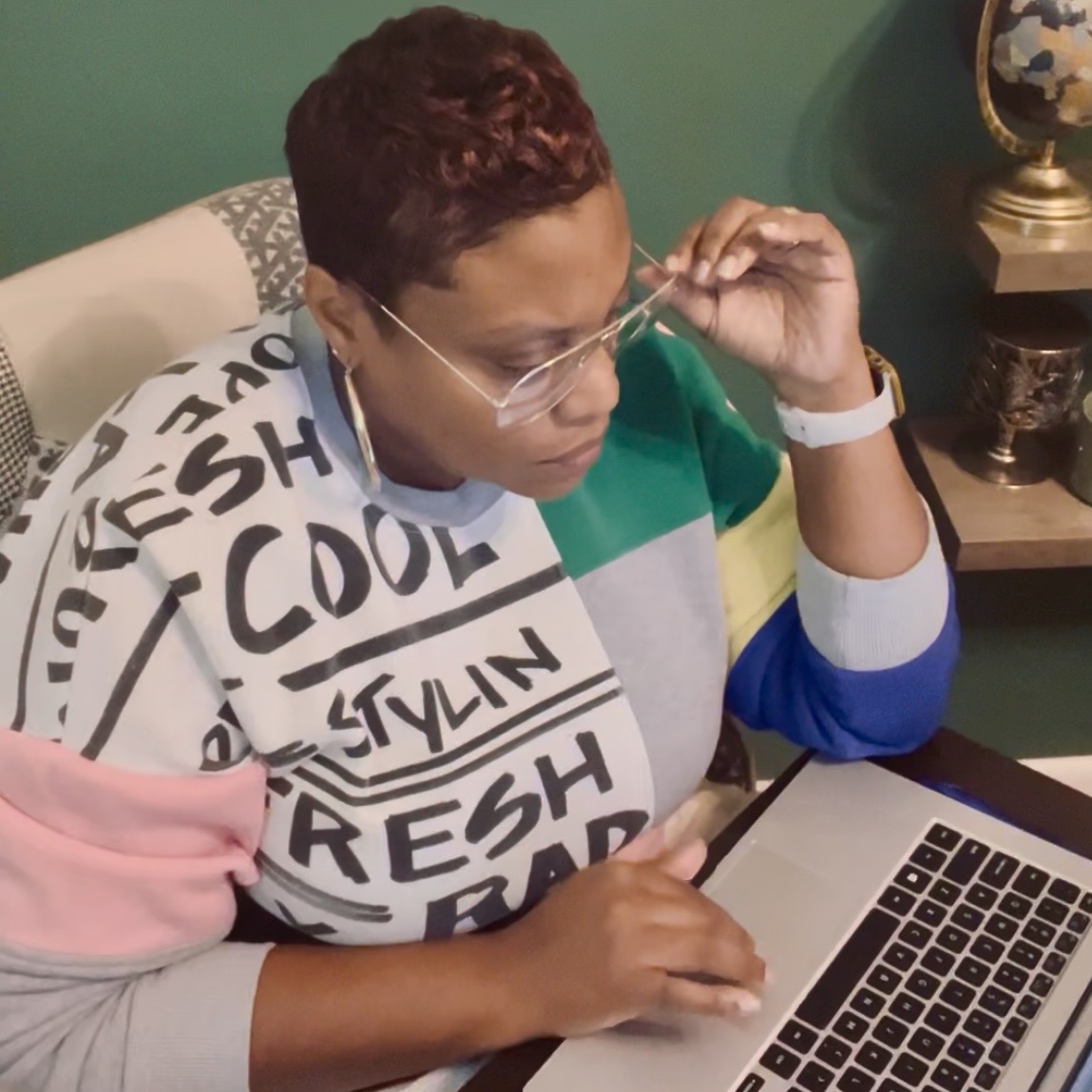 Founder of Signature Your Design Travel LLC working at her desk planning intentional travel journeys.